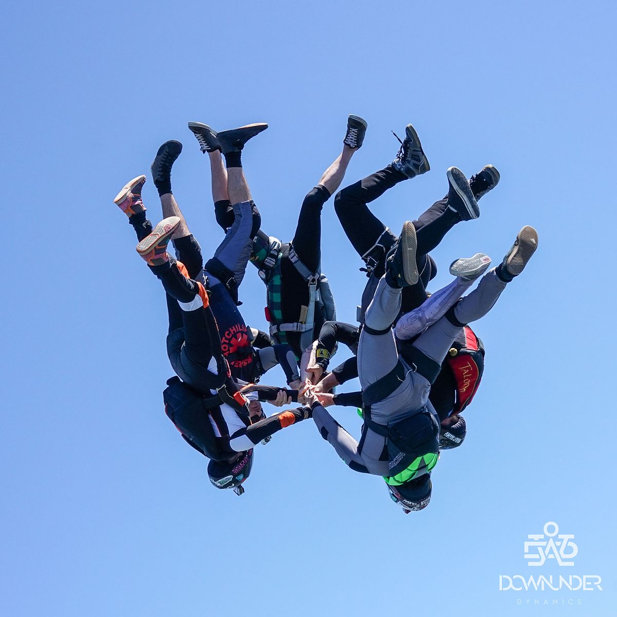 A head-down formation gripped up against blue sky