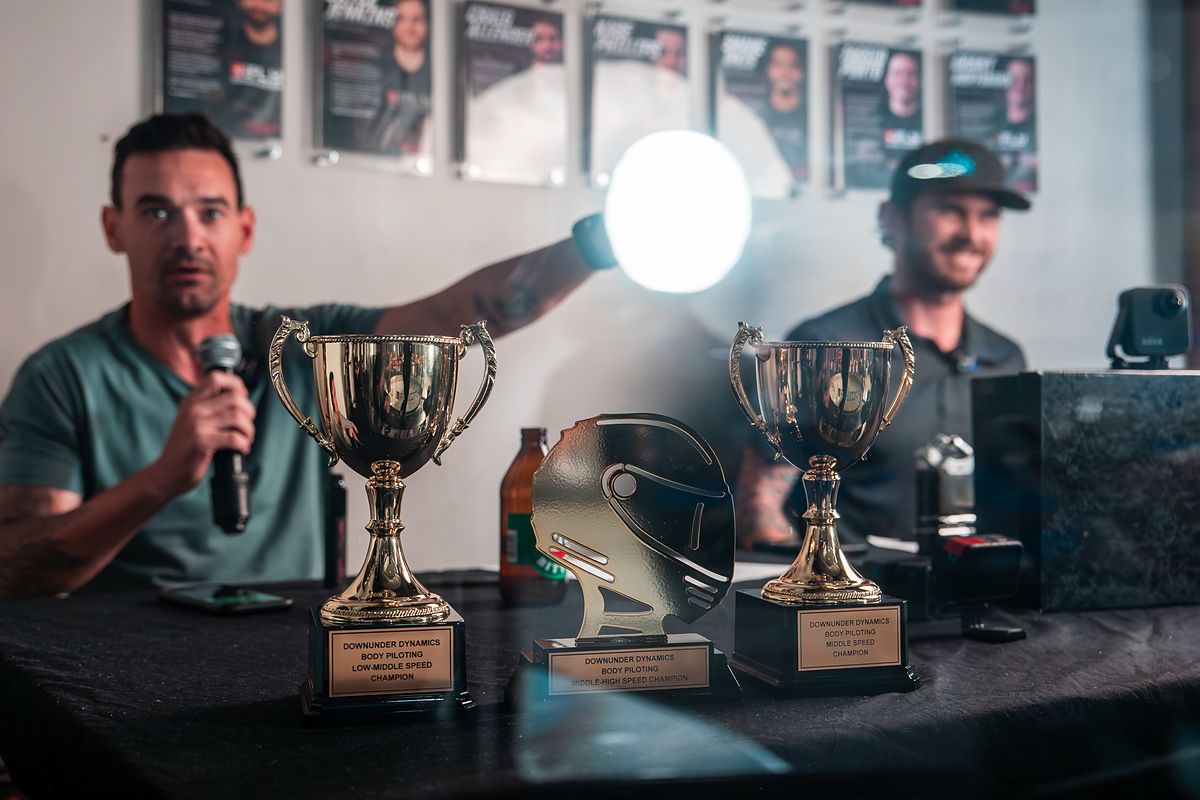 Trophies lined up on the table at a Body Piloting event