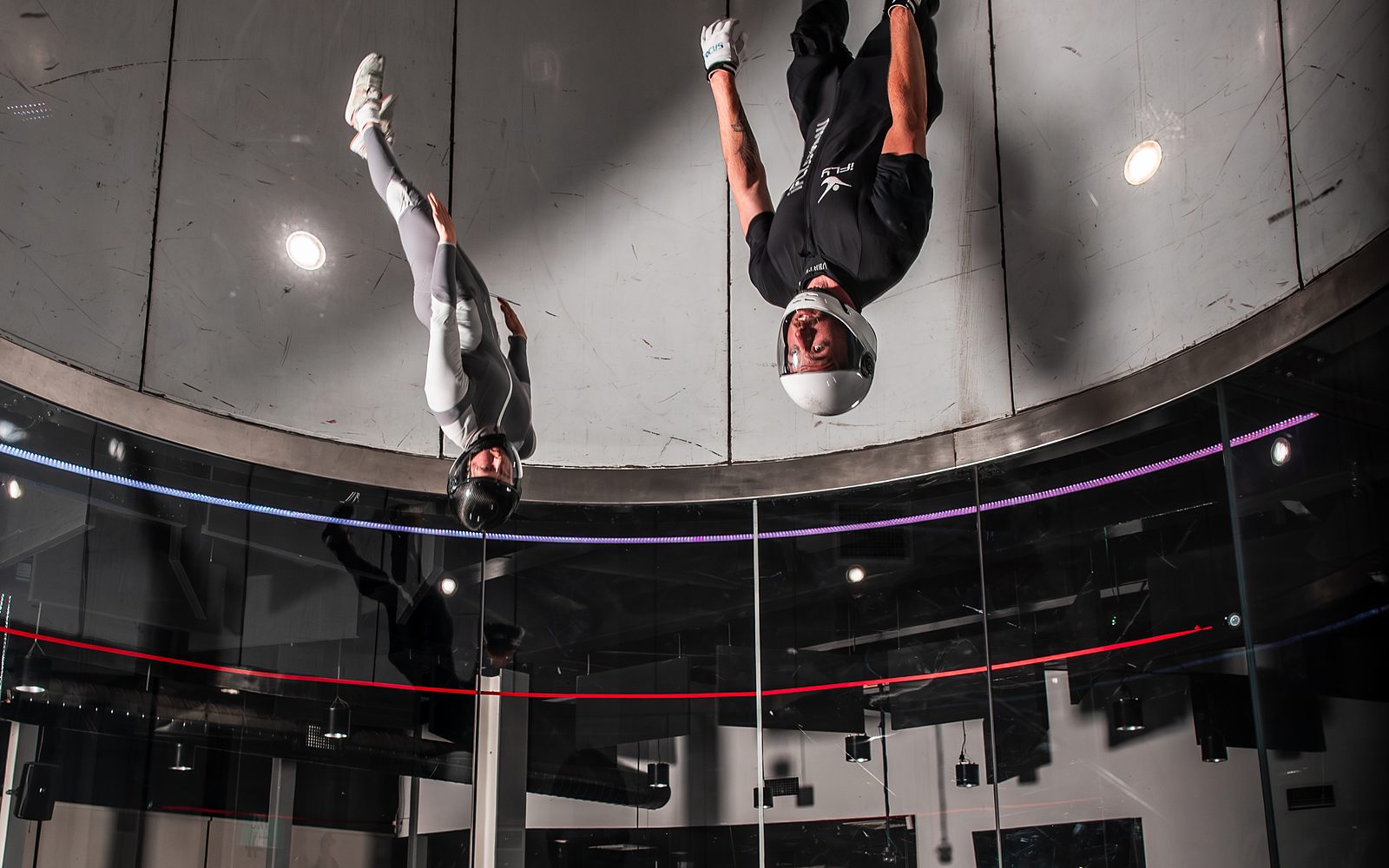 Two flyers inverted in the wind tunnel during a Body Piloting round